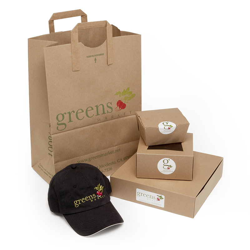 Greens labeled grocery bag, boxes and hat